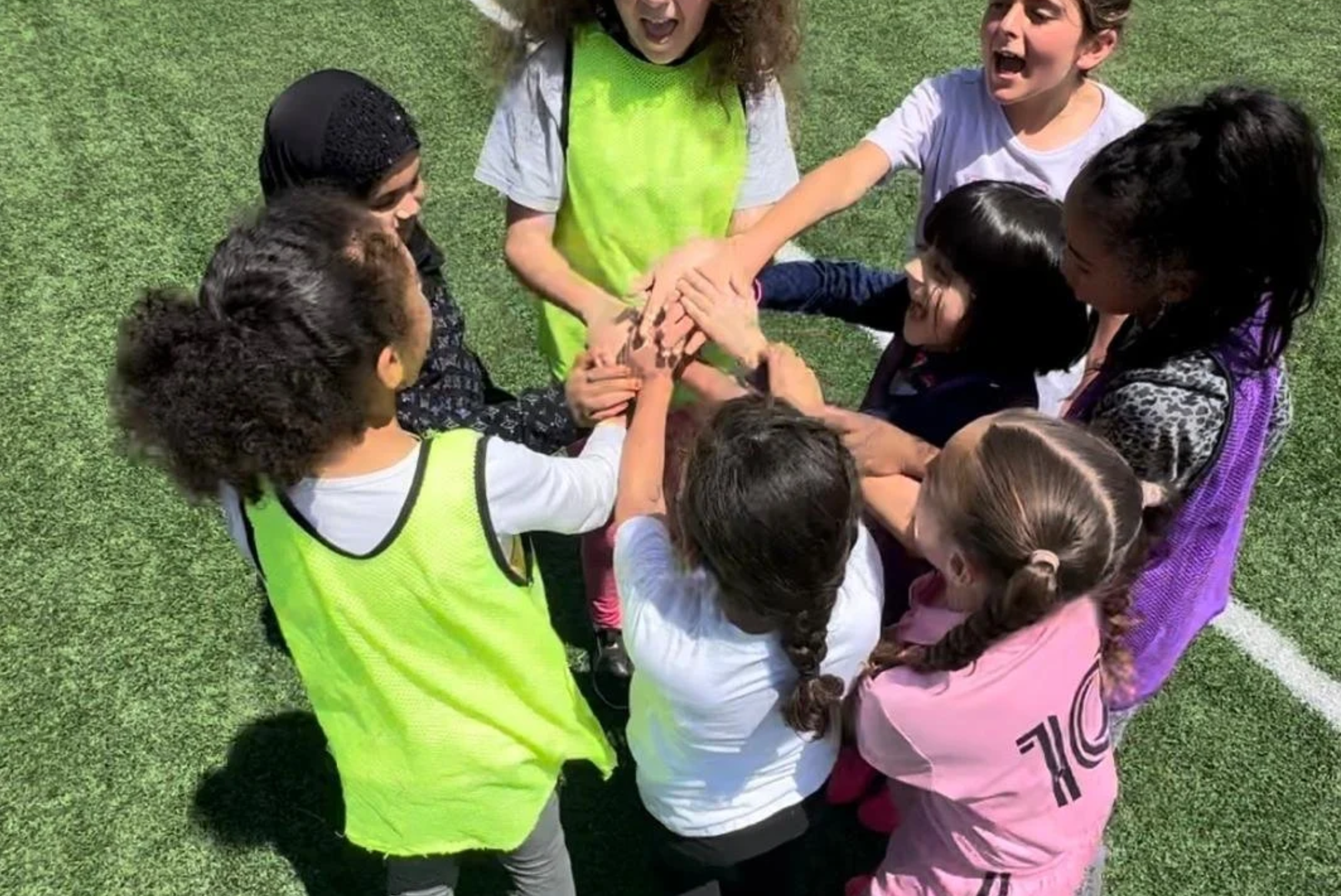 Team huddle representing cooperation